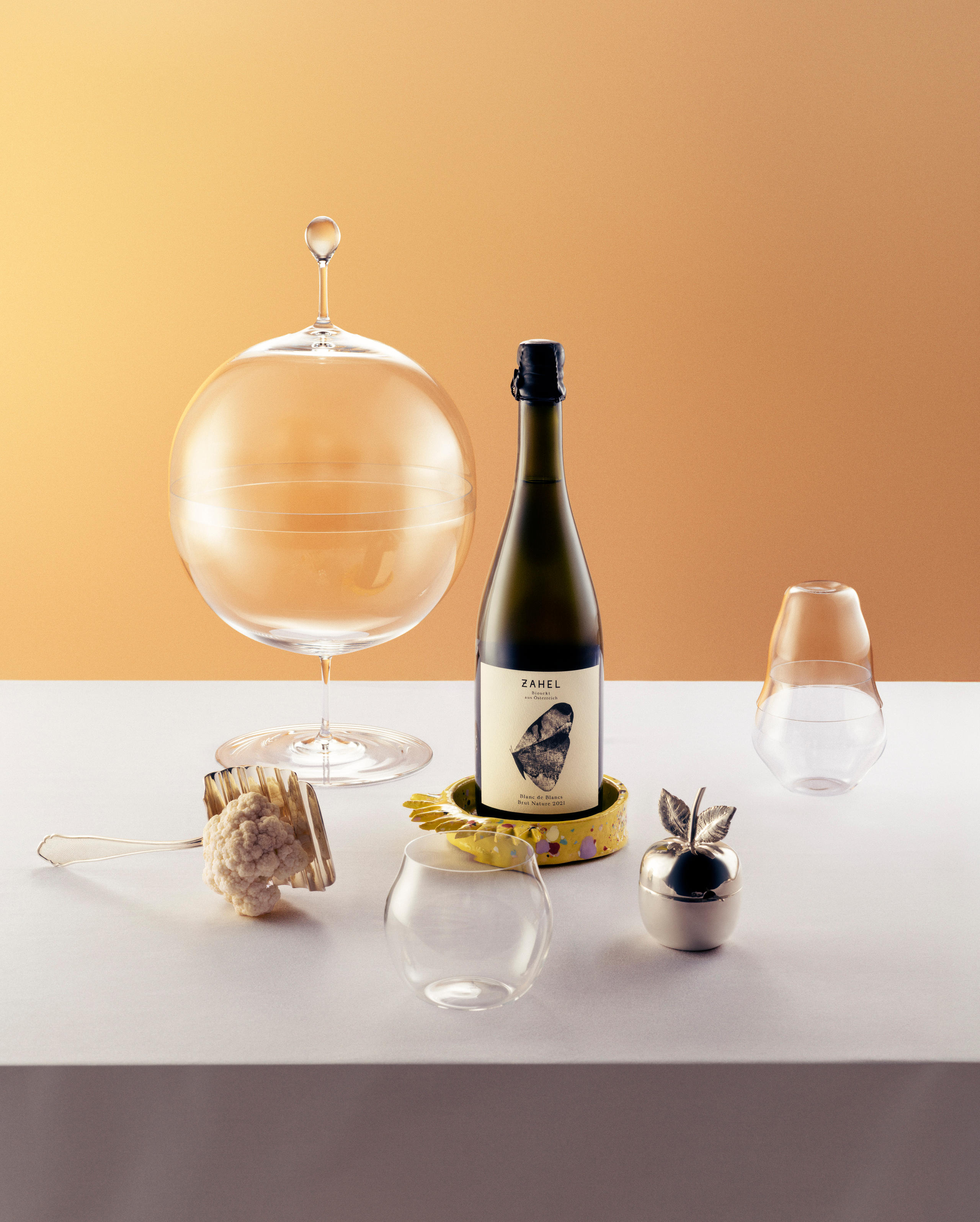 Bottle of sparkling wine with decorative items