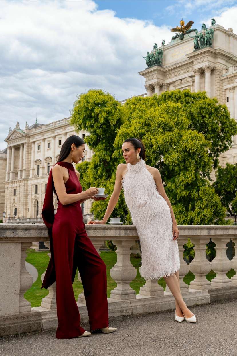Two women chatting on a terrace in the Burggarten