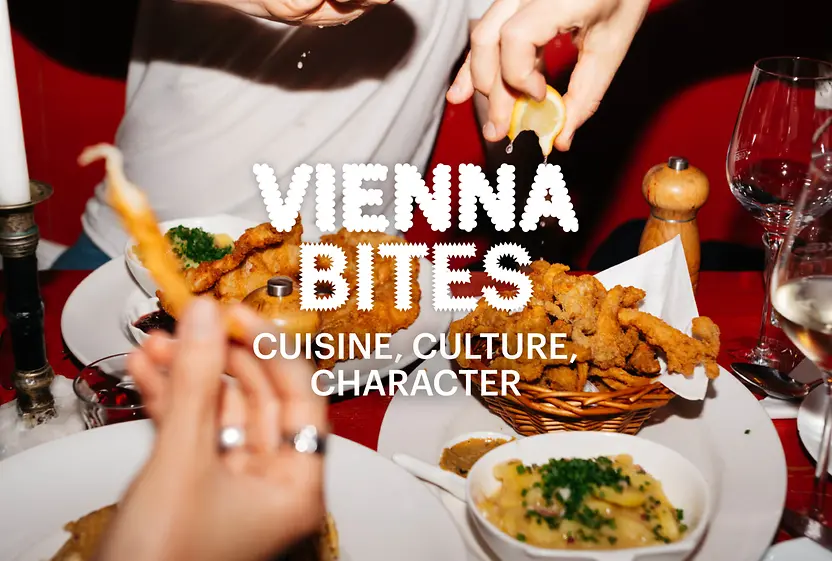 Slogan “Vienna Bites. Cuisine, Culture, Character” in the background Food on a table