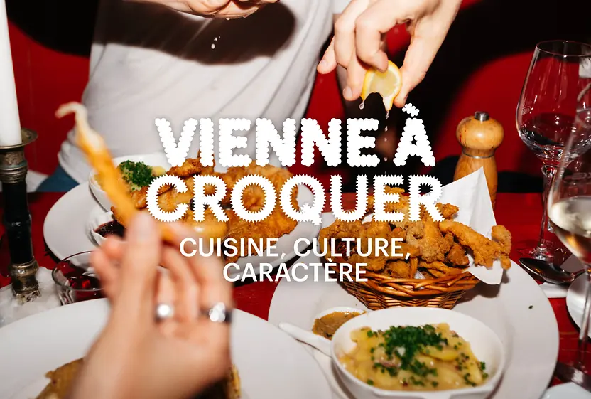 Slogan « Vienna à Croquer. Cuisine, culture, caractère » en arrière-plan Nourriture sur une table