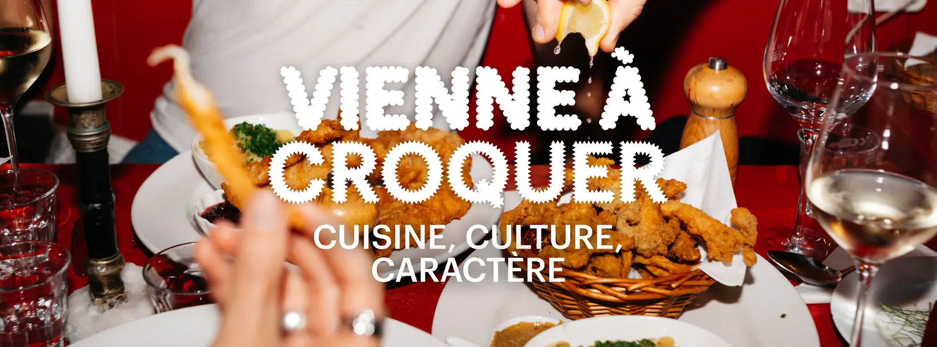 Slogan « Vienna à Croquer. Cuisine, culture, caractère » en arrière-plan Nourriture sur une table