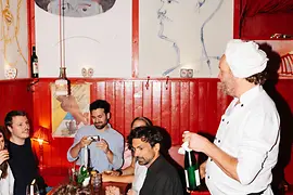 A group of friends sitting in a Viennese tavern