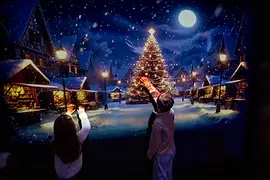 Children playing in front of a winter landscape