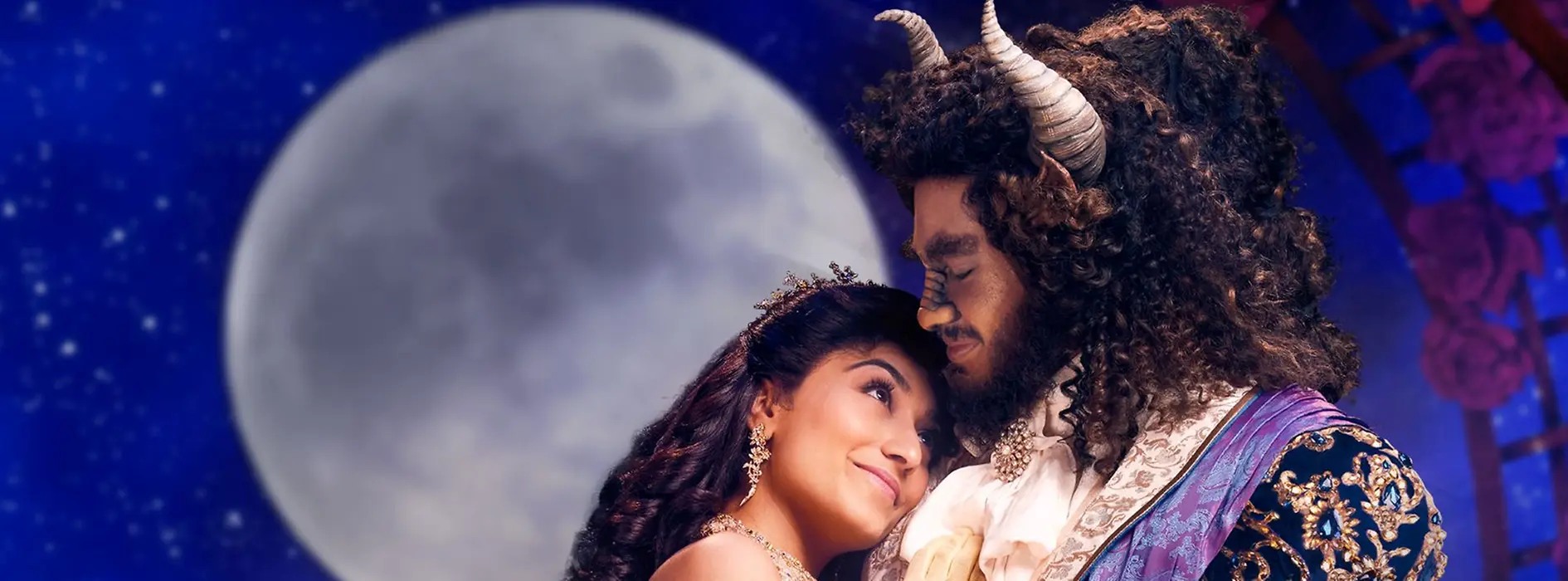 Beauty and the Beast embracing, with the full moon behind them.