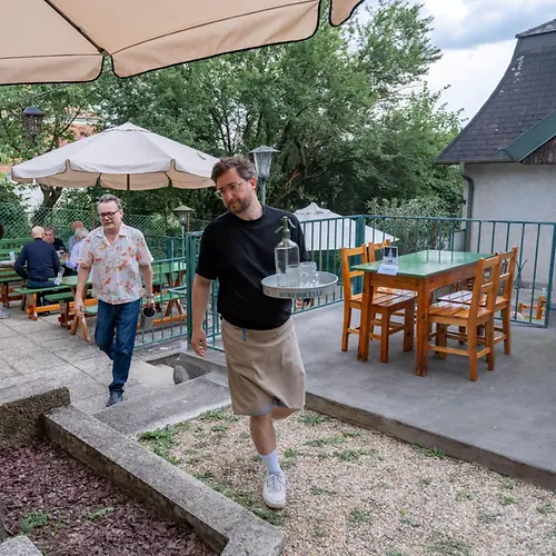 Garden of a heuriger with a waiter