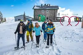 People snowshoeing on the Rax