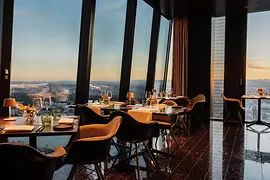 Restaurant with set tables and a view of Vienna
