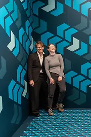 Ames Room with visitors at the Museum of Illusions 