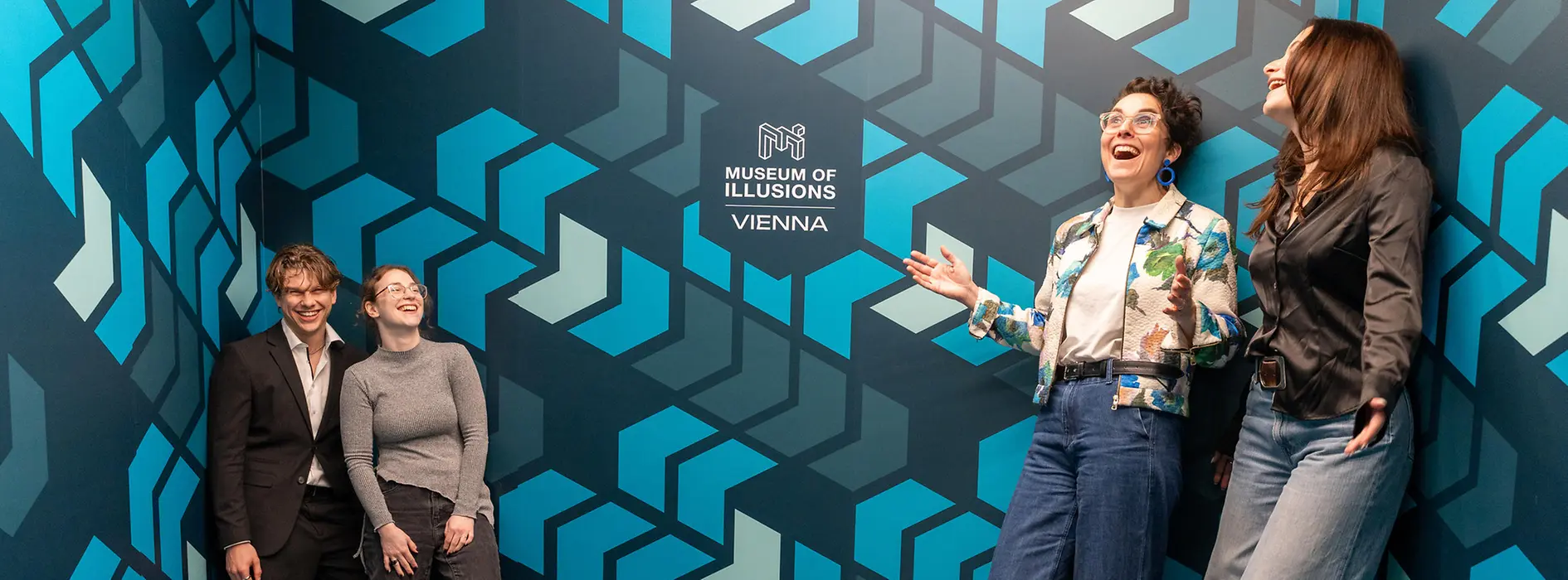 Ames Room with visitors at the Museum of Illusions 