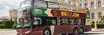 Red electric hop-on hop-off double-decker bus by Big Bus Tours in front of the Natural History Museum Vienna