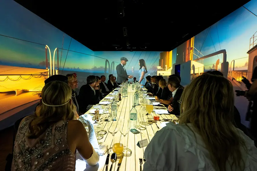 Titanic-themed dinner show with guests at the Immersium