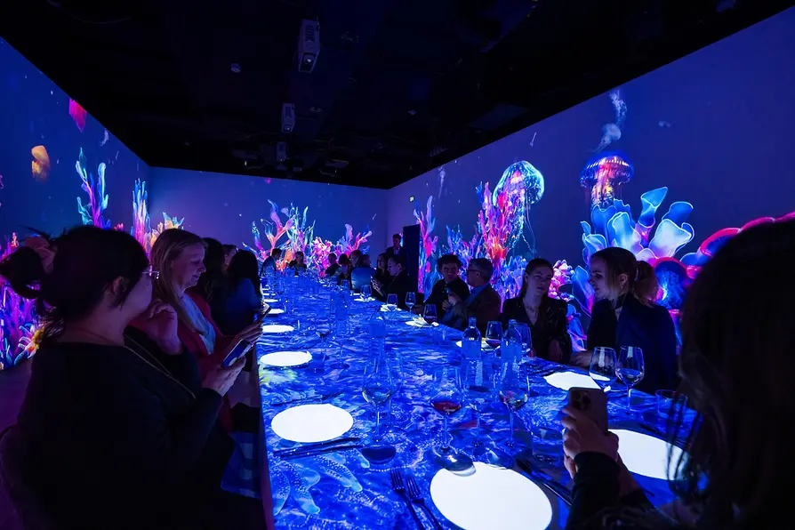 Titanic-themed dinner show with guests at the Immersium