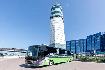 CAT by Bus in front of the tower of Vienna Airport