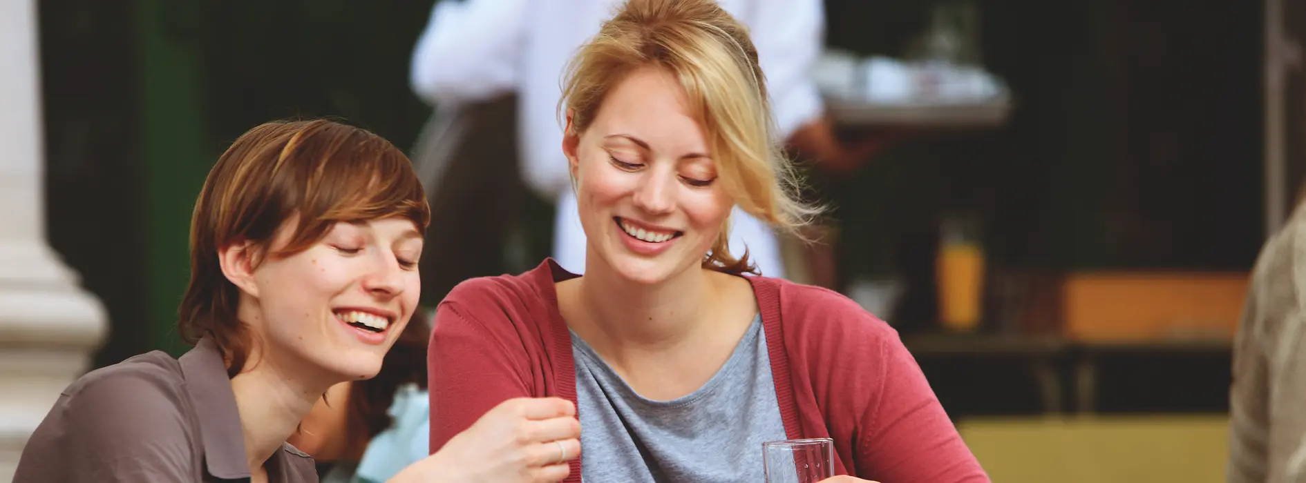 Two women drinking coffee