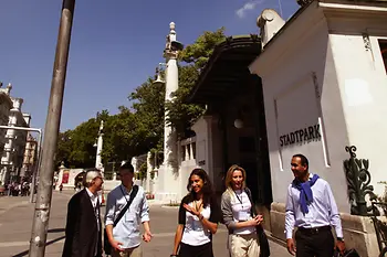 Group of people in front of the Stadtpark subway station 