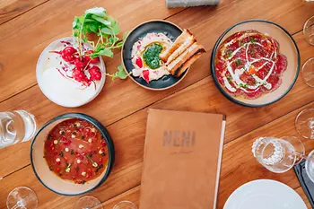 Neni by the water, food on plates