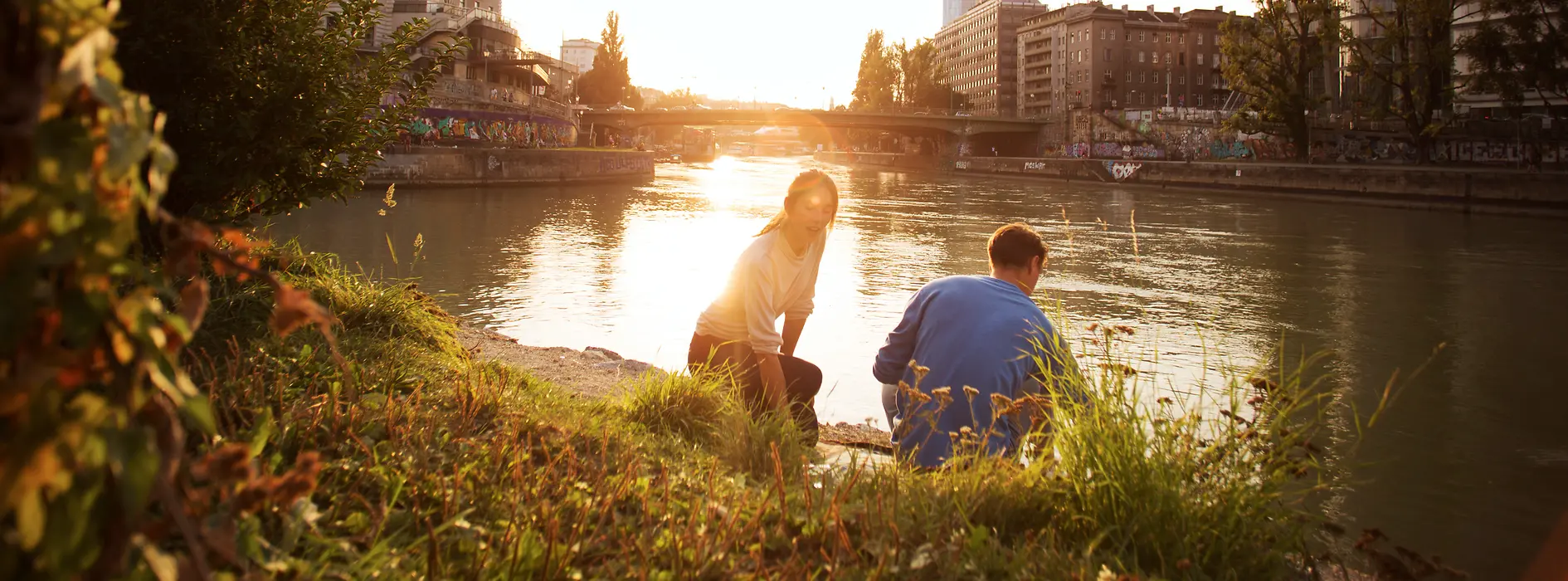 Couple in front of the sunset on the Danube Canal
