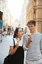 Strolling around in the Old City, couple eating ice cream