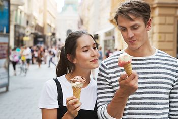 Strolling around in the Old City, couple eating ice cream