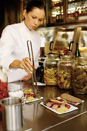 woman preparing sausage