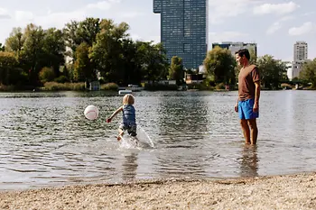 Family swimming in the Old Danube