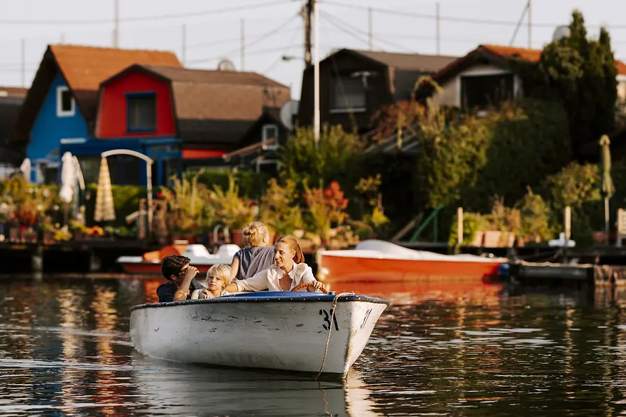 Family on a boat on the Old Danube