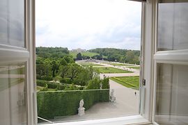 View from a window looking at Schönbrunn Palace park and the Gloriette