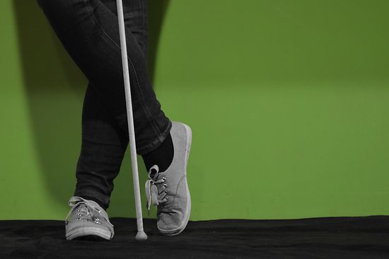 Woman with a blindman's stick