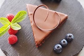 Chocolate dessert in the shape of a triangle