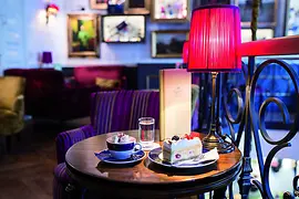 Coffee house table with coffee and cake