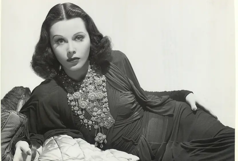 Hedy Lamarr lying on a couch