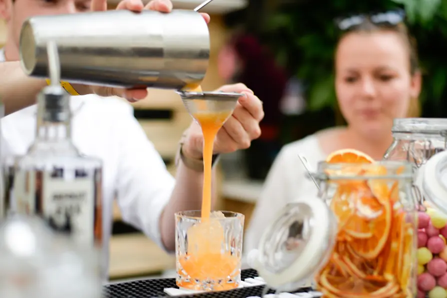 People at an al fresco cocktail festival