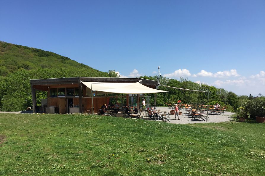 Restaurant on a hill with a terrace in front of it