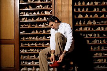 Man in front of shoe lasts