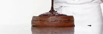 Sachertorte getting its chocolate glaze