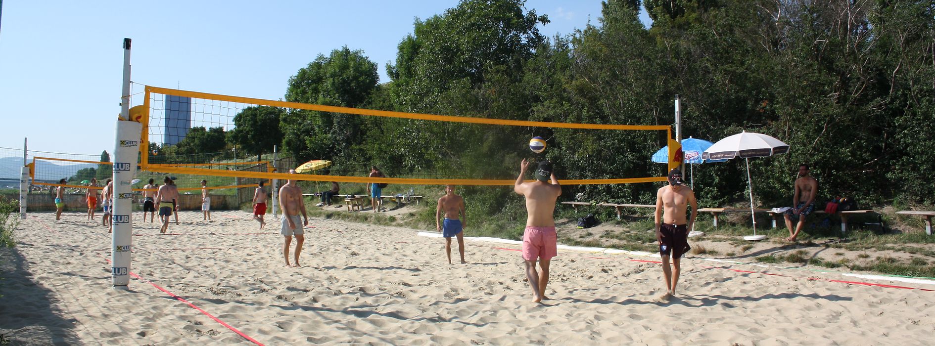 Beach volleyball players in action at the Vienna City Beach Club