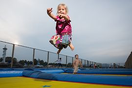 Girl jumping at the Danubejumping trampoline at Donauinsel
