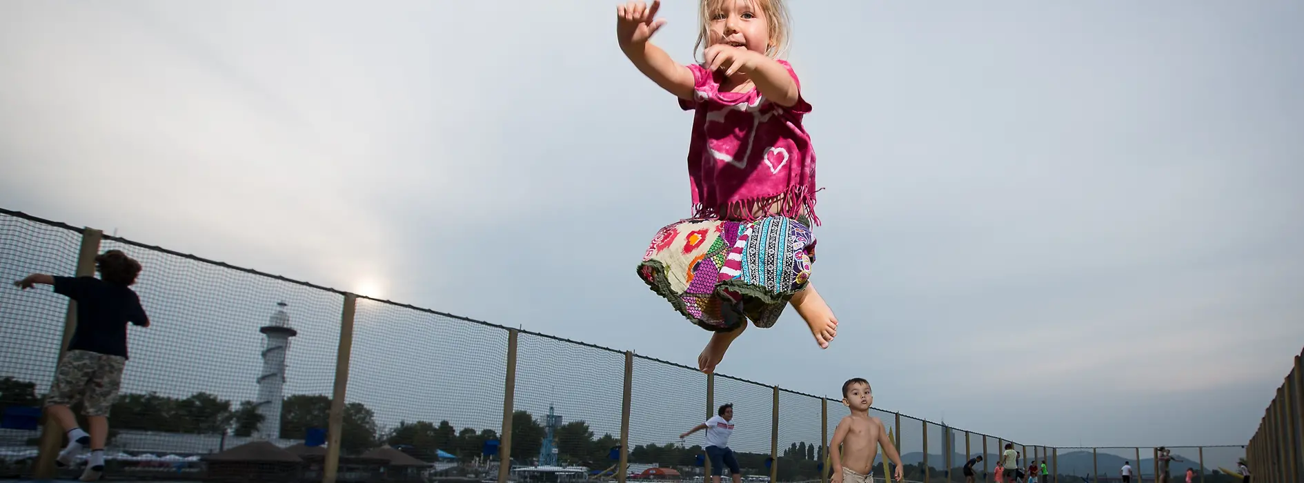 Girl jumping at the Danubejumping trampoline at Donauinsel