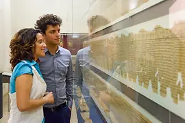 Couple looking at papyrus