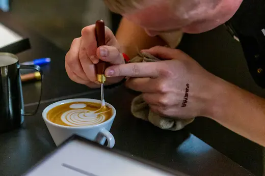 Artistic milk foam on a coffee