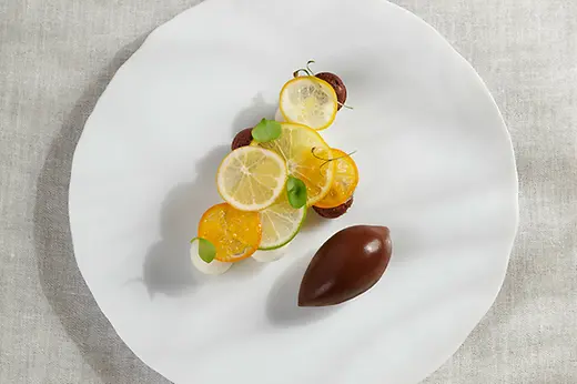 Dessert du restaurant Steirereck : agrumes de Schönbrunn avec cacao et noix de coco jeune