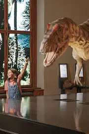 Family in the Naturhistorisches Museum Vienna marvels at dinosaurs