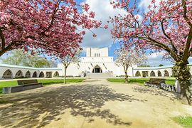 Vienna's Central Cemetery: View of the Feuerhalle crematorium and blooming cherry trees