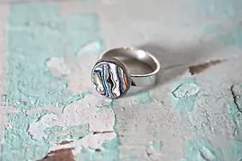 Birdly upcycling, ring made from layers of graffiti paint