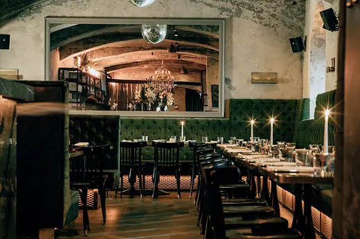 Motto restaurant with glitterballs and tables with candles