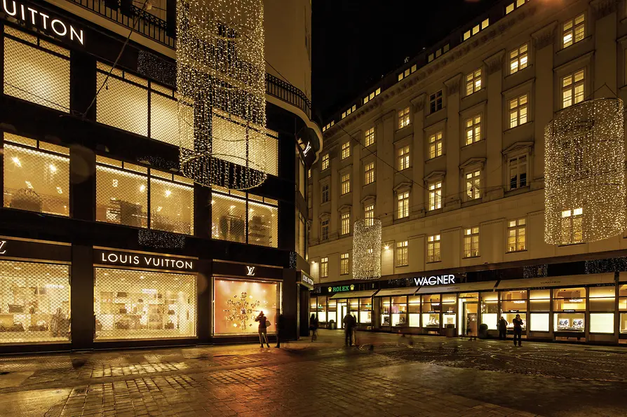 View of the luxury stores of Louis Vuitton and Juwelier Wagner jewelers