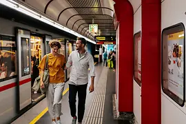 Woman and man on a platform of subway line U1