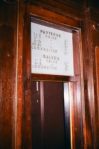 Metro Kino interior shot: Historic sign displaying prices