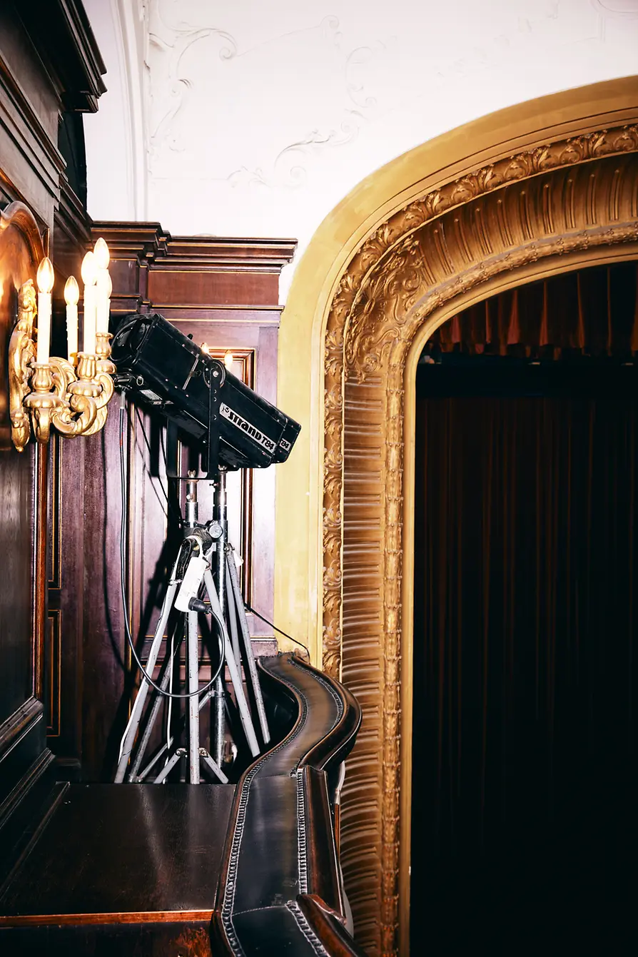 Metro Kino interior shot: Baroque wall lights, spotlights, magnificent proscenium arch