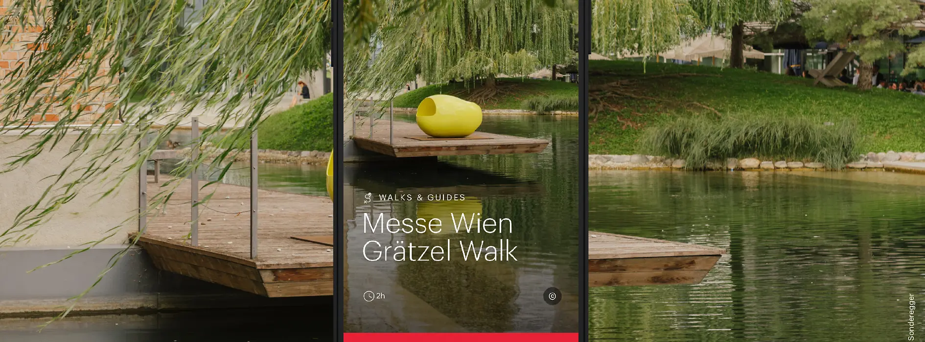 Soggetto pubblicitario ivie Messe Wien Grätzel Walk - superficie d’acqua con alberi e oggetti d’arte